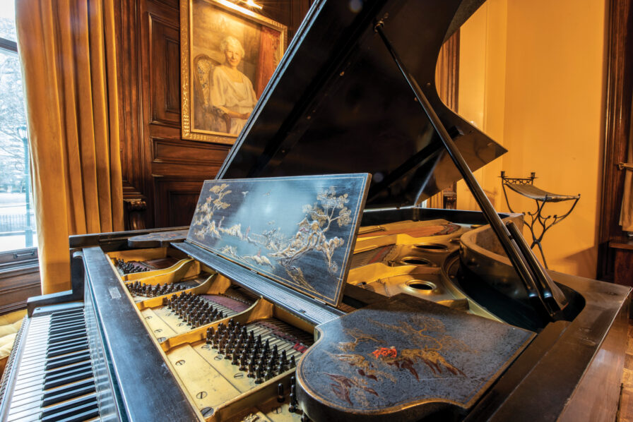 A chinoiserie-decorated grand piano in the Bok Board Room